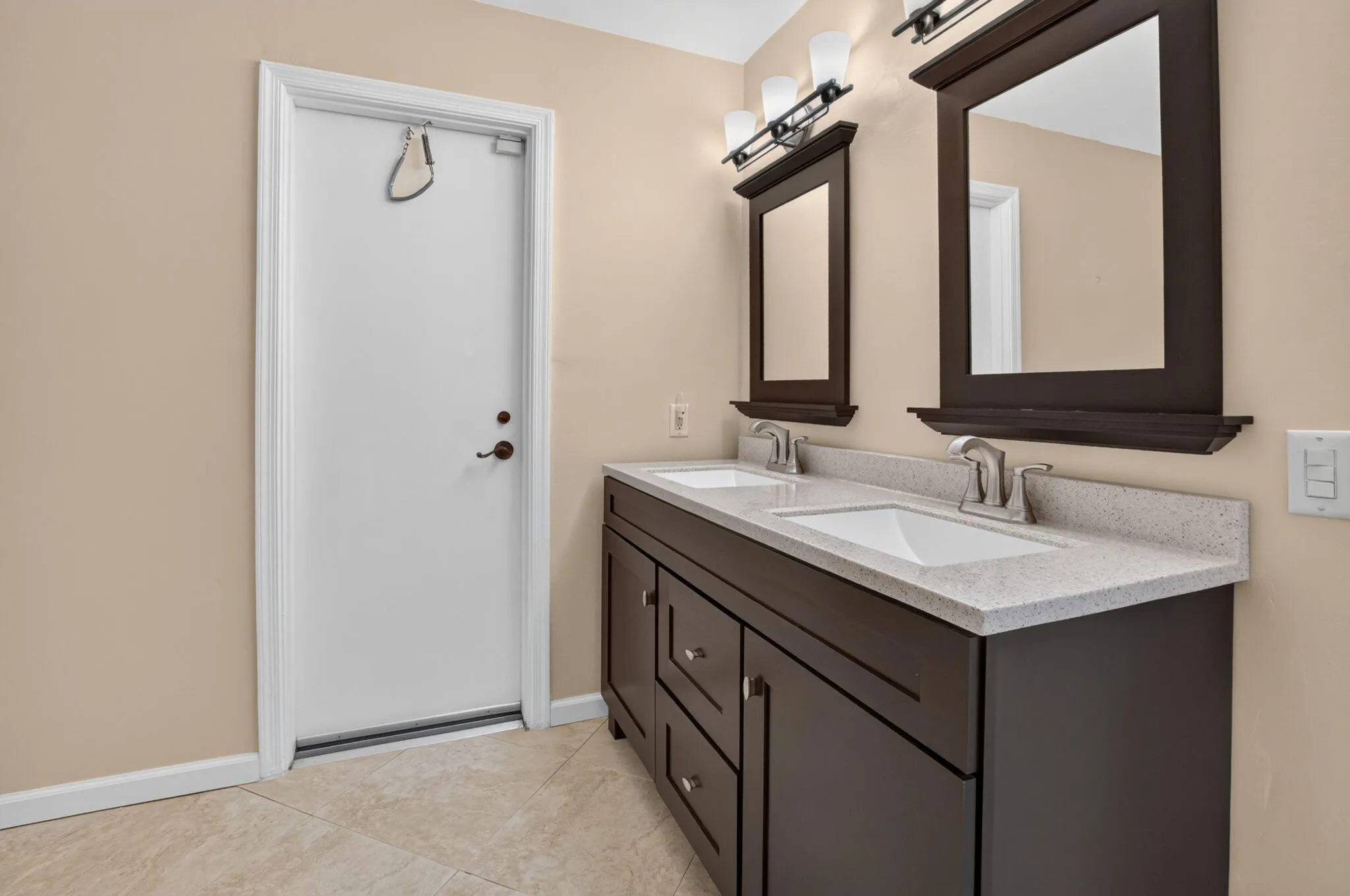 with double vanity and entrance to pool