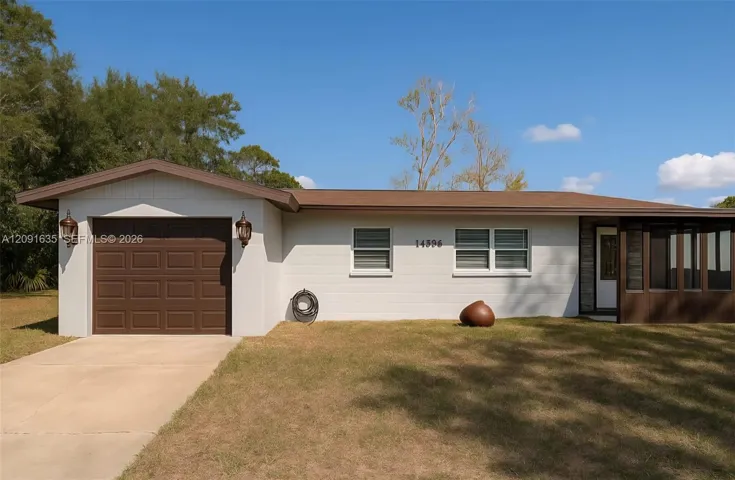 Additional view of the front yard and property approach in the quiet El Jobean neighborhood.