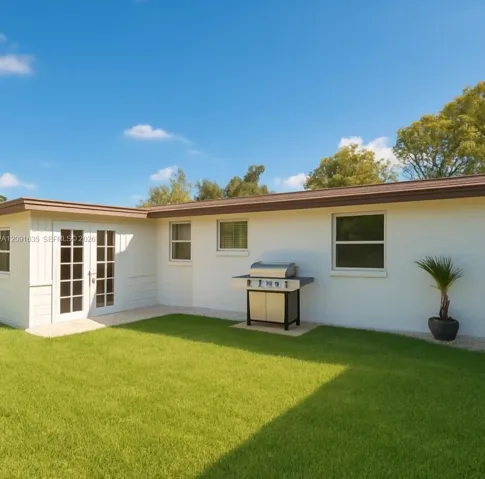 Expansive fenced-in backyard offering endless potential for entertaining, pets, gardening, or a future pool.
