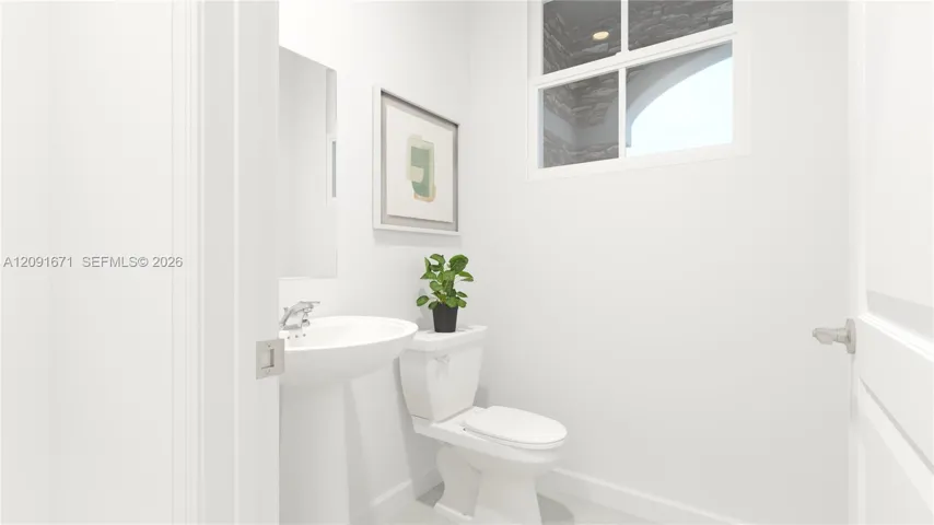 Right off the entryway is a powder room to readily accommodate the needs of the whole household and visiting guests.