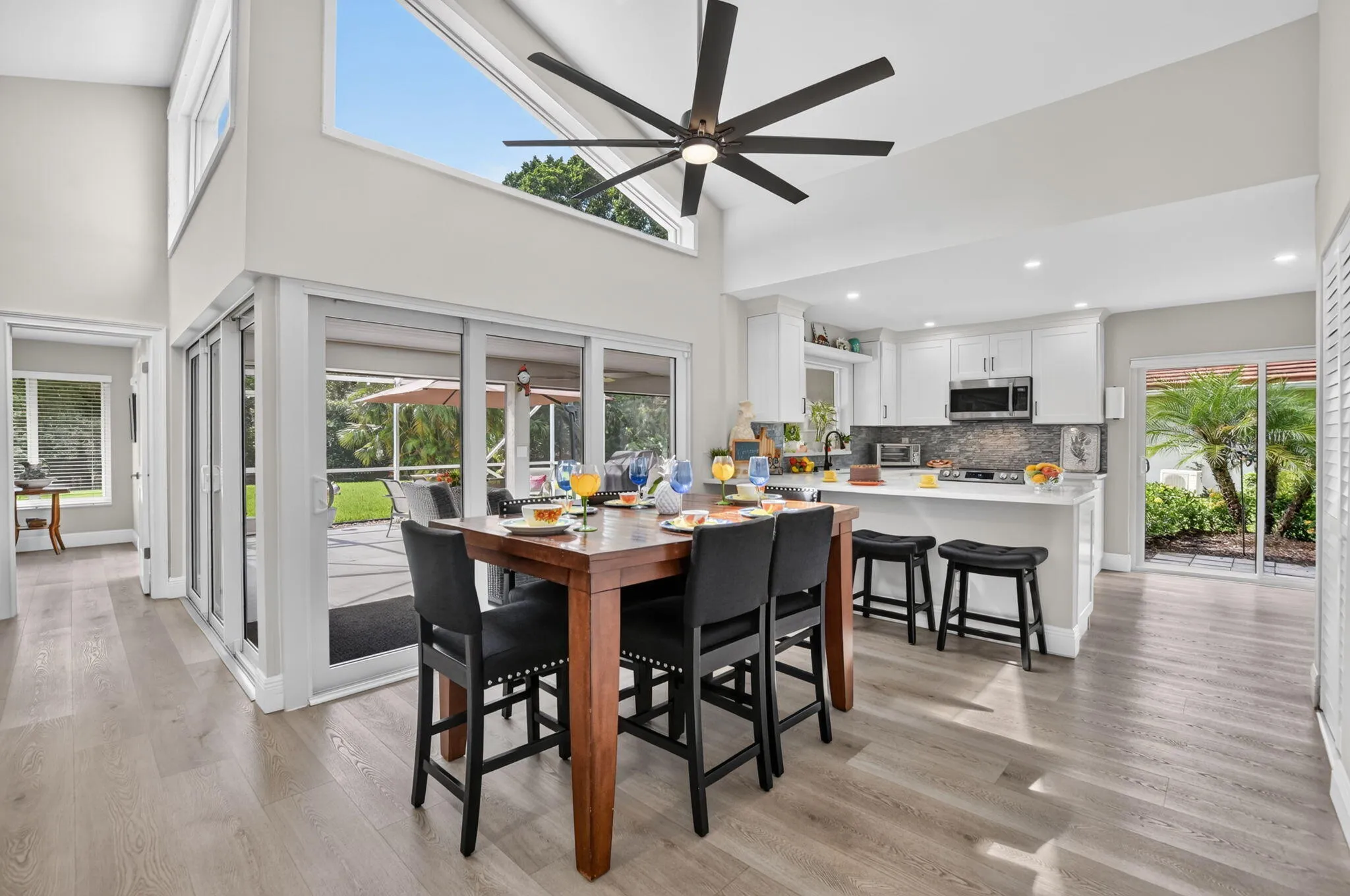 Bright dining area opens directly to the covered, screened patio.