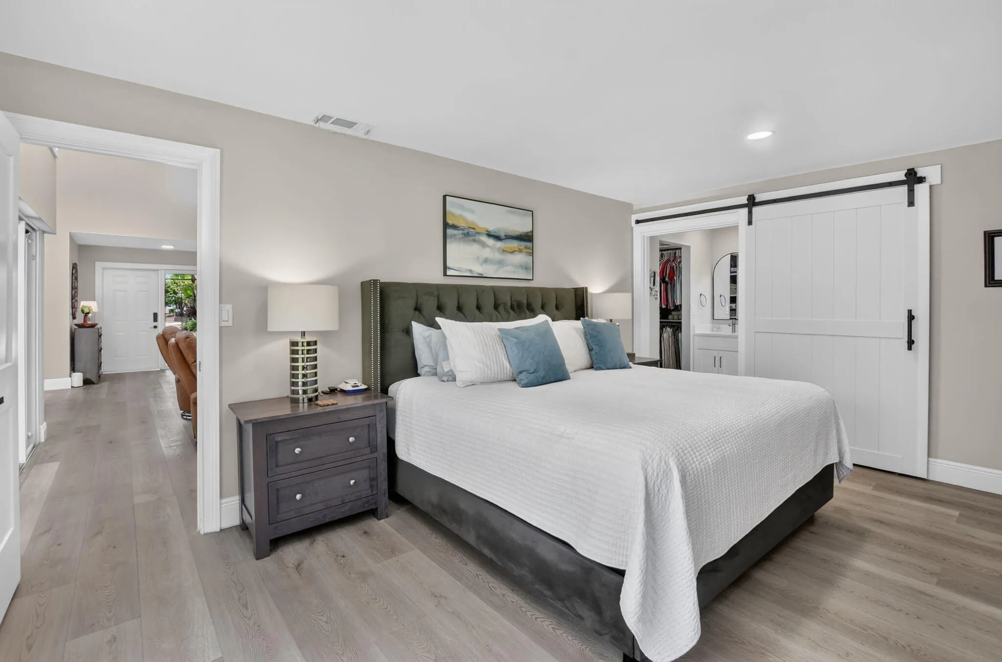 Fall in love in the oversized primary suite with a 4' rolling barn door for privacy.