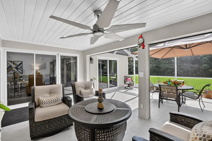 22' x 21' screened patio with tongue and groove ceiling offers generous space for dining and relaxing.