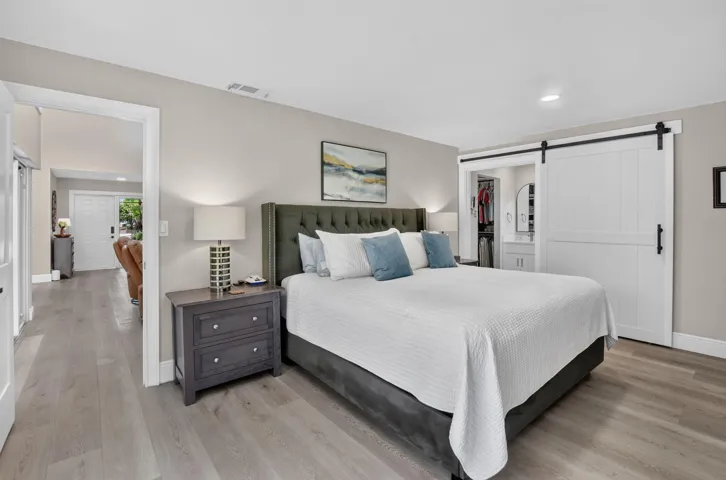 Fall in love in the oversized primary suite with a 4' rolling barn door for privacy.