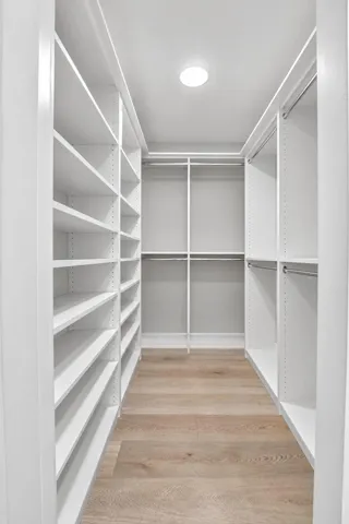 Great walk-in closet with build out cabinetry is perfect for fashion fans!