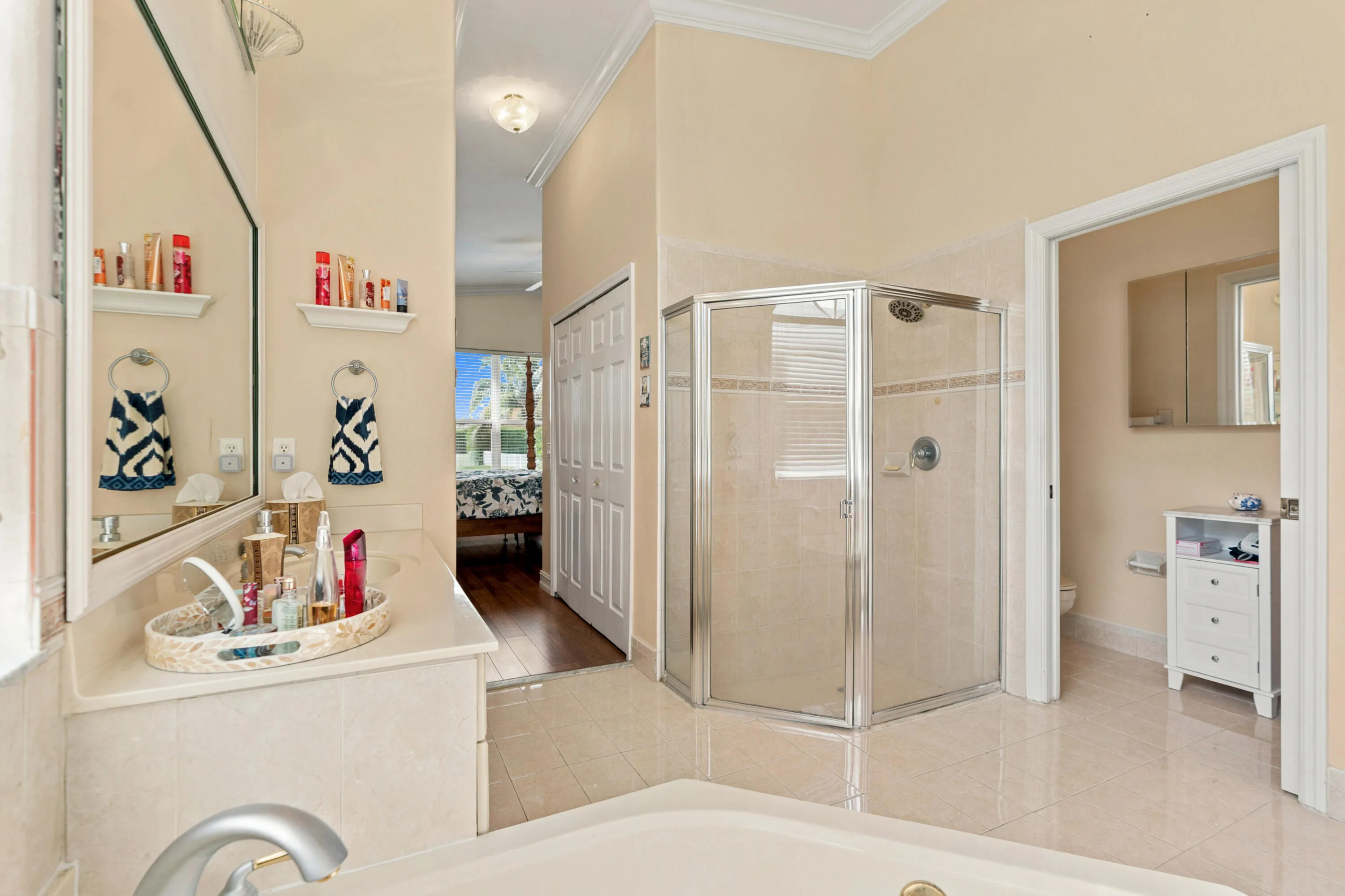 Separate shower and private water closet complete the primary bath’s functional layout.