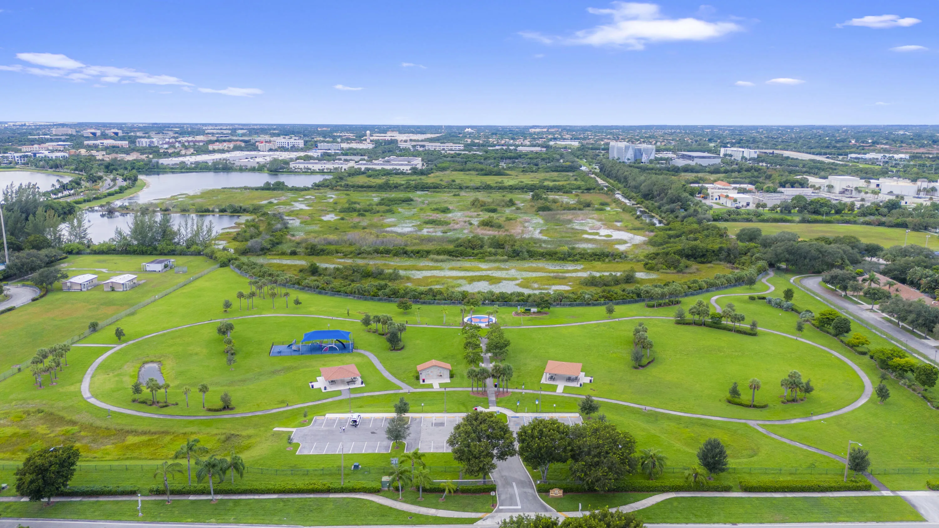 Monarch Lakes neighborhood park featuring expansive lush greenery throughout the community.