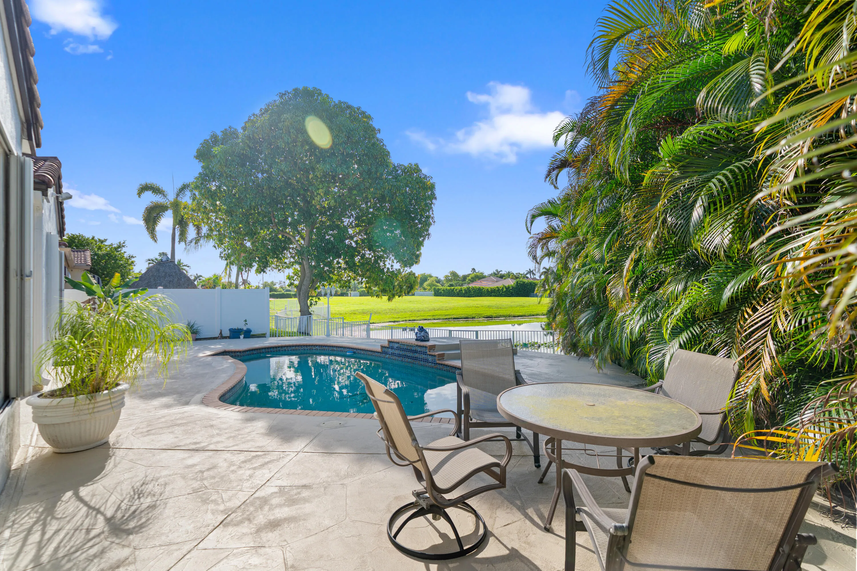 Expansive pool deck provides plenty of room for outdoor dining, lounging and entertaining.