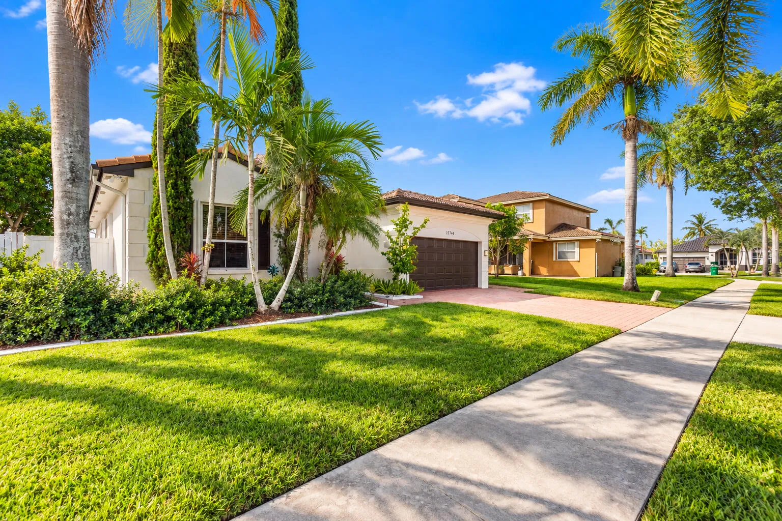 Beautifully maintained lawn and mature landscaping enhance the home’s curb appeal.