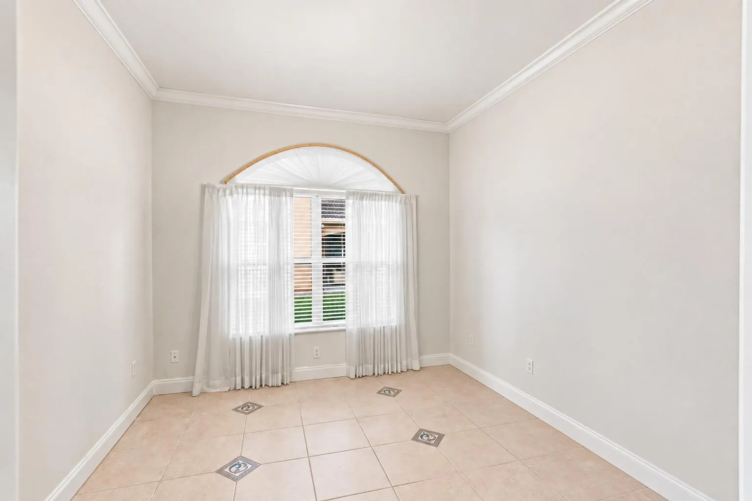 Flexible room that can be used as a den, home office, or home gym.