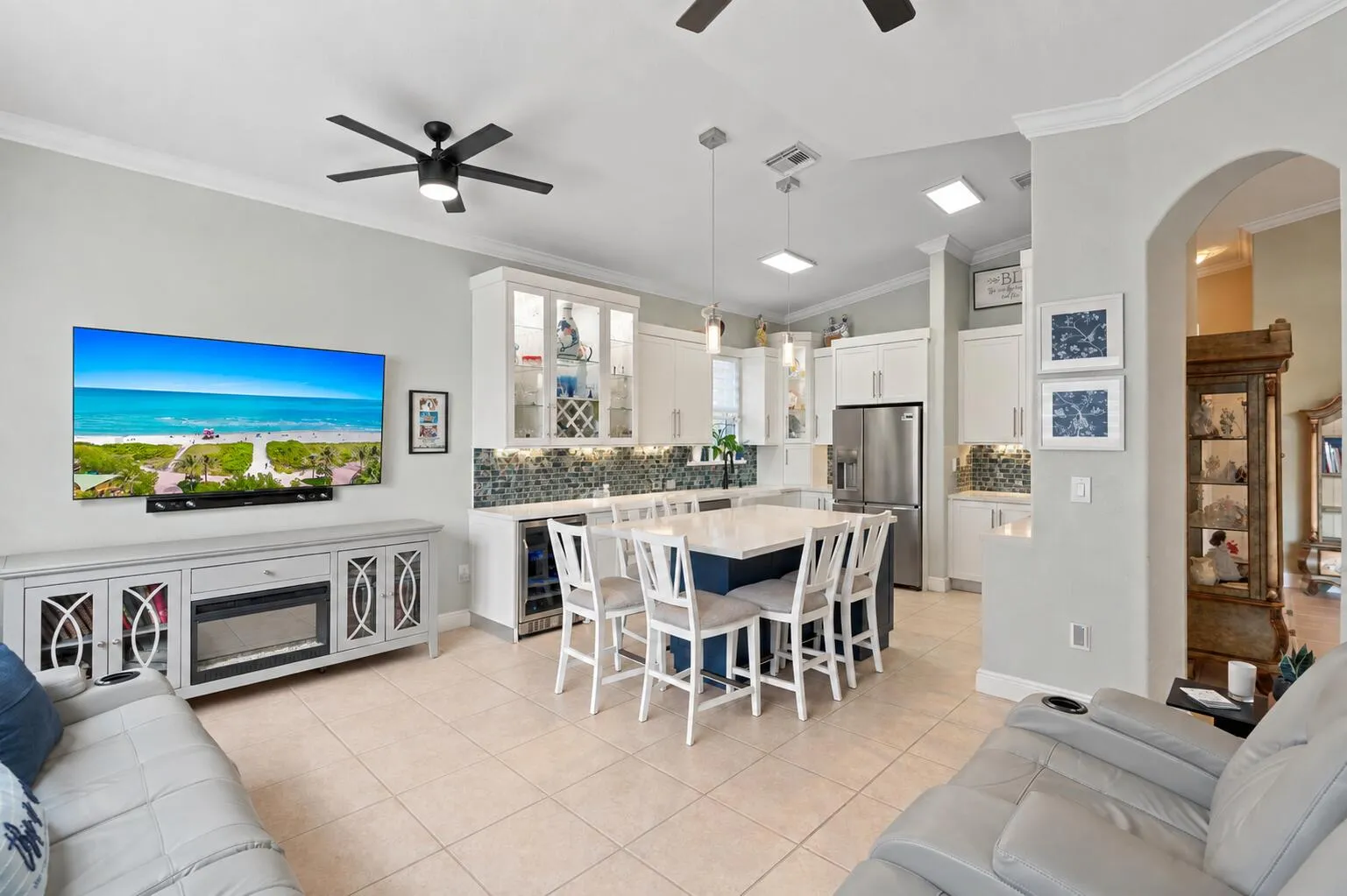 The kitchen and family room come together in a bright, connected gathering space.