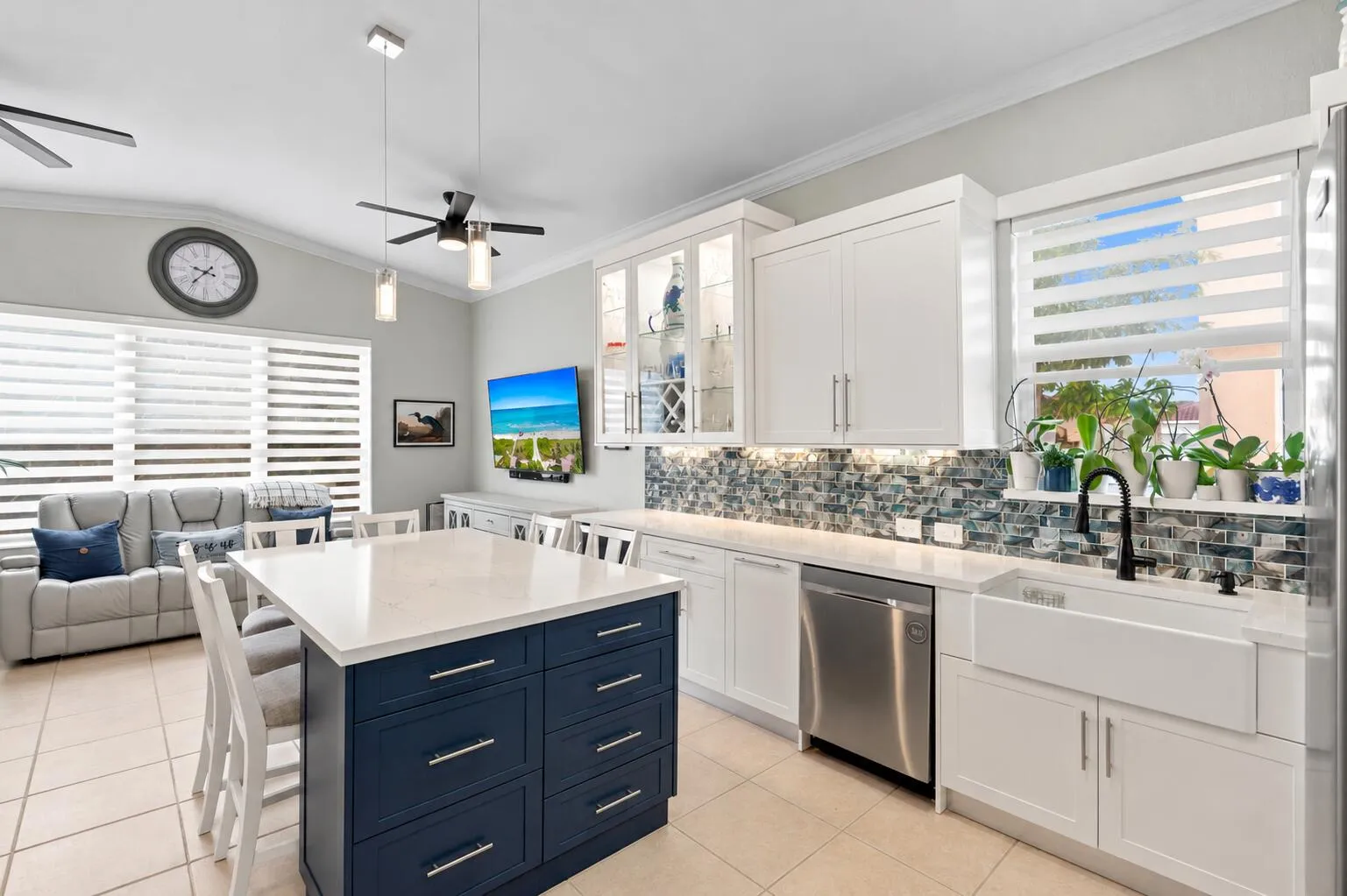 A large center island with abundant drawer storage creates a functional hub for everyday living.