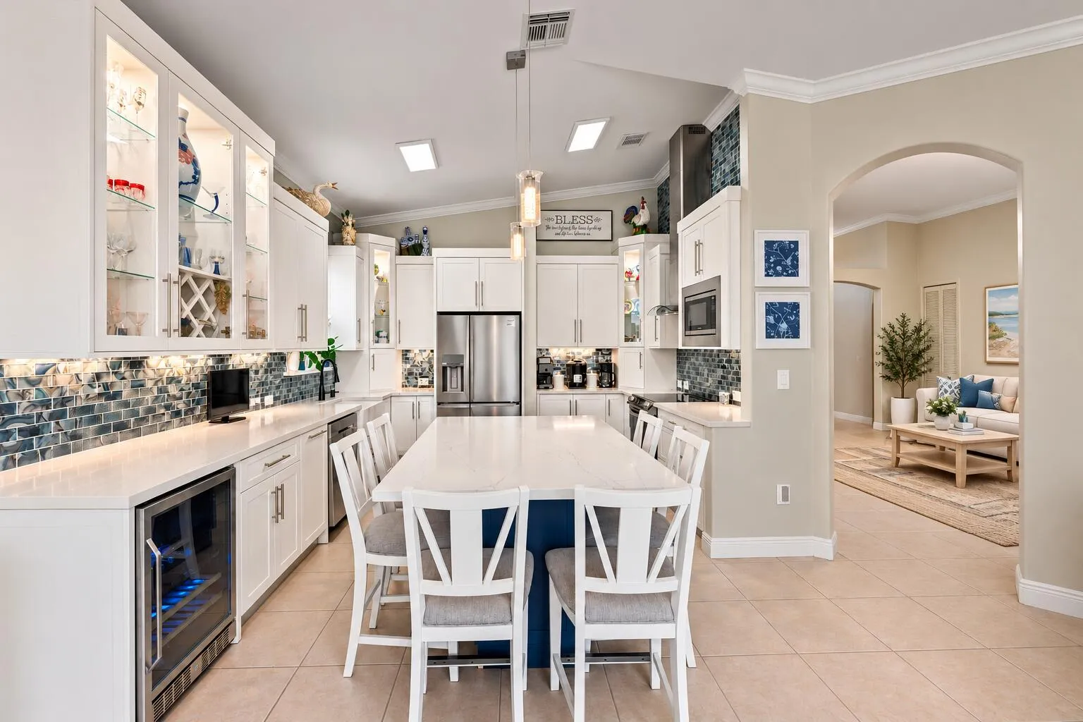 The oversized island anchors the kitchen, with seating that keeps conversation close to the action.