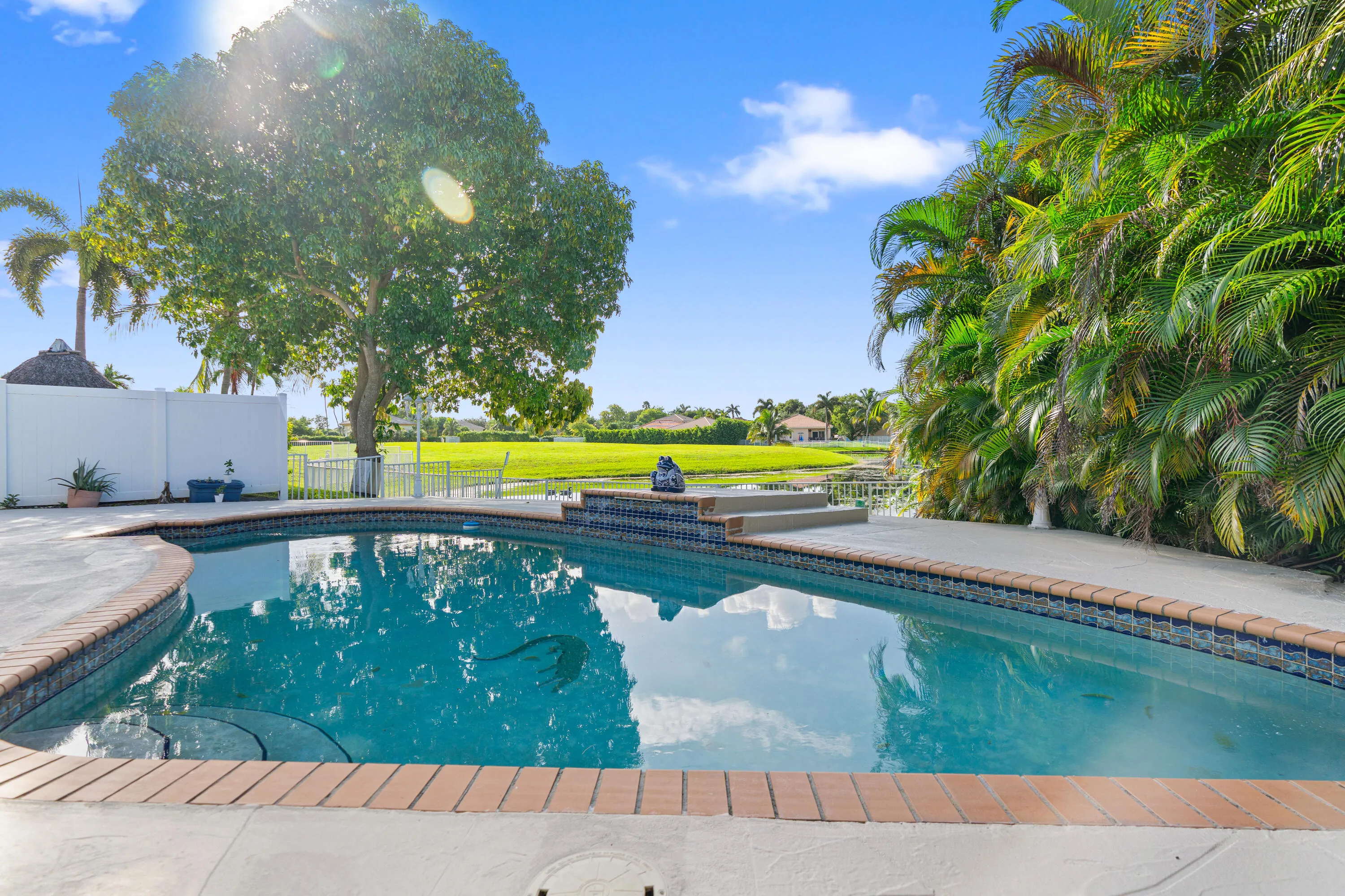 Inviting pool and surrounding deck create a private setting for enjoying South Florida’s year-round sunshine.