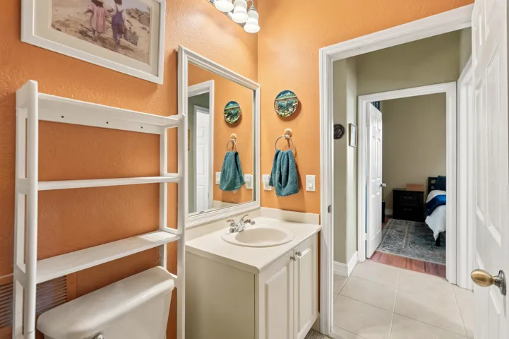 Additional view of the full bath and its convenient connection to the adjacent bedroom area.