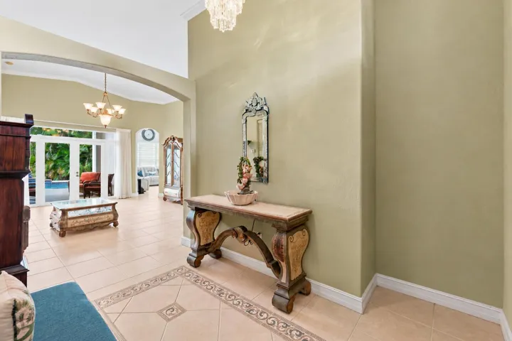An arched opening introduces the main living area and its easy connection to the outdoors.