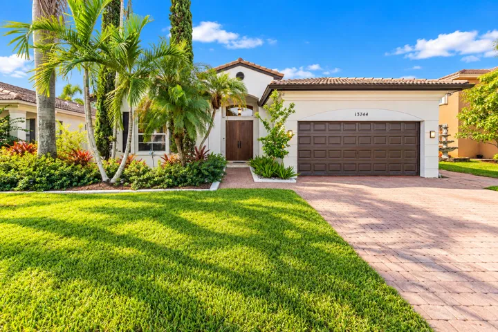 Waterfront, single-story living with 3-BD, 2.5-BA home offers 1,881 sq. ft. of living area with private heated pool, renovated 2023 kitchen, and flexible den/office room.