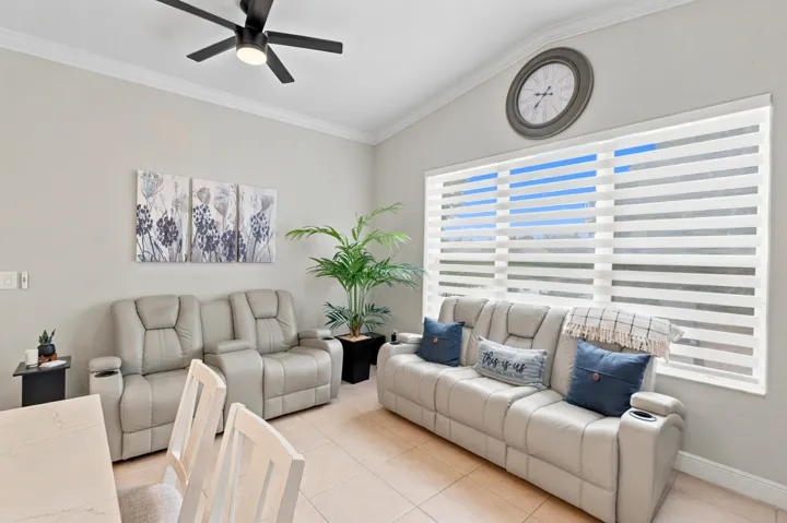 A bright family room provides comfortable gathering space just steps from the kitchen.