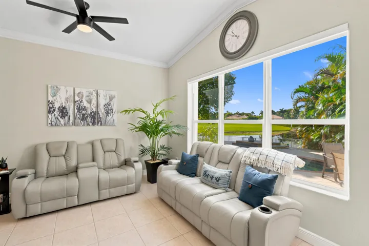 A bright family room provides comfortable gathering space just steps from the kitchen.