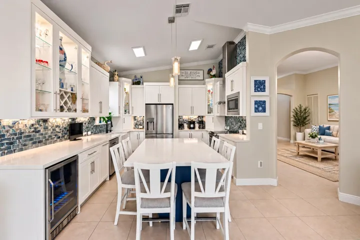 The oversized island anchors the kitchen, with seating that keeps conversation close to the action.