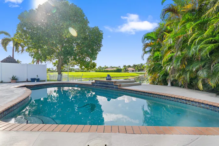 Inviting pool and surrounding deck create a private setting for enjoying South Florida’s year-round sunshine.