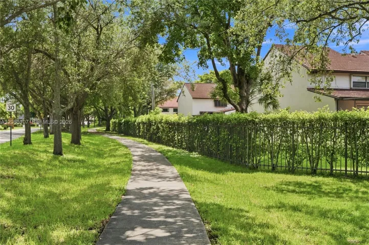 Oak-shaded paths surround Calusa Point