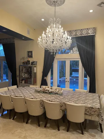 Dining Room open floor to living room and outside to the pool