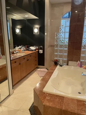 Master bath - his and her sides, separate toilet room