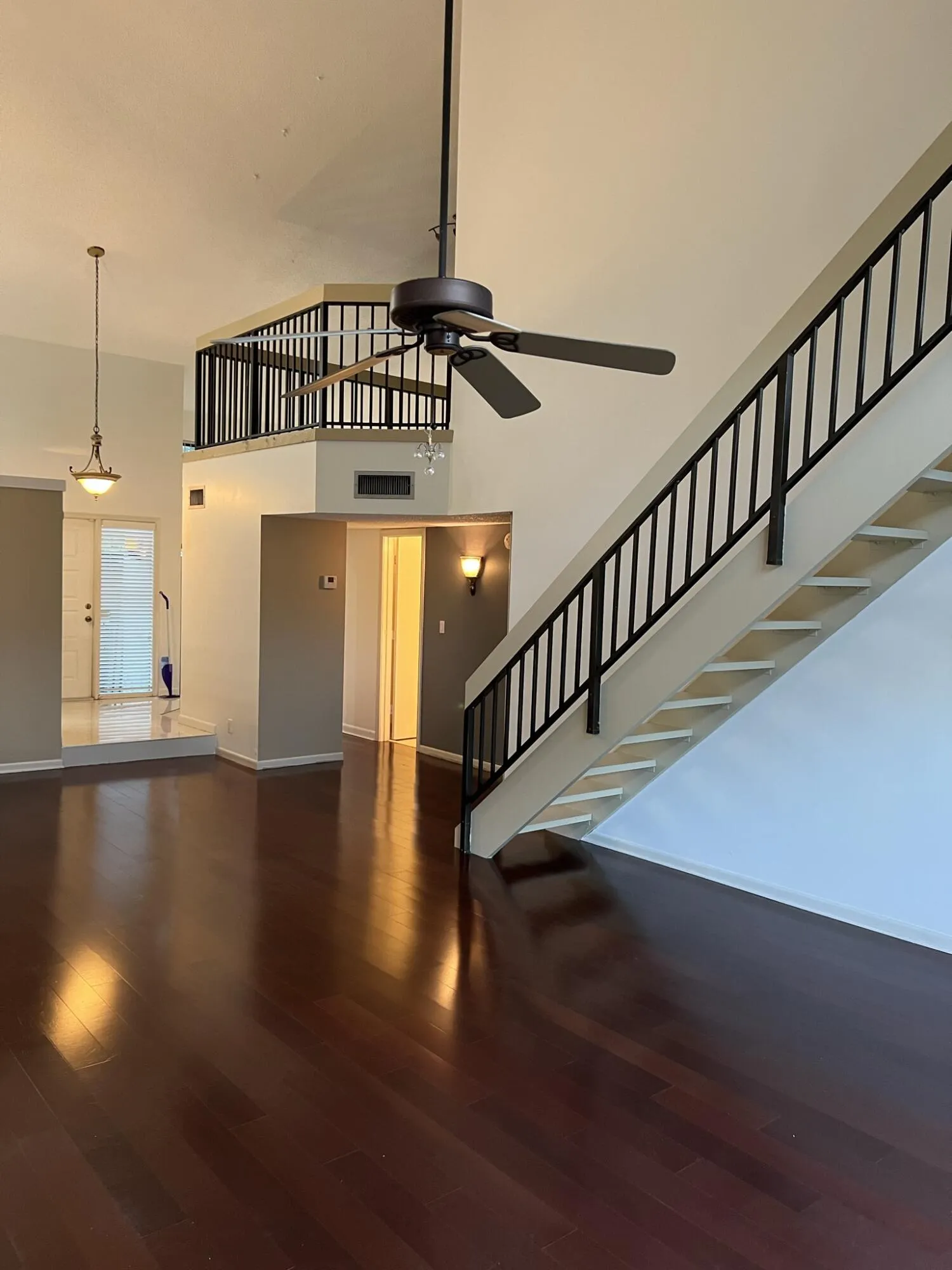 Mahogany engineered wood flooring on both floors.