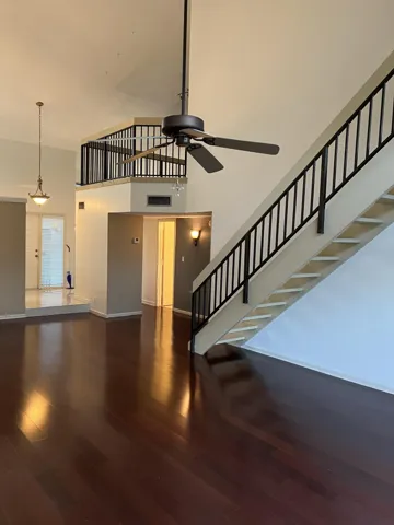 Mahogany engineered wood flooring on both floors.