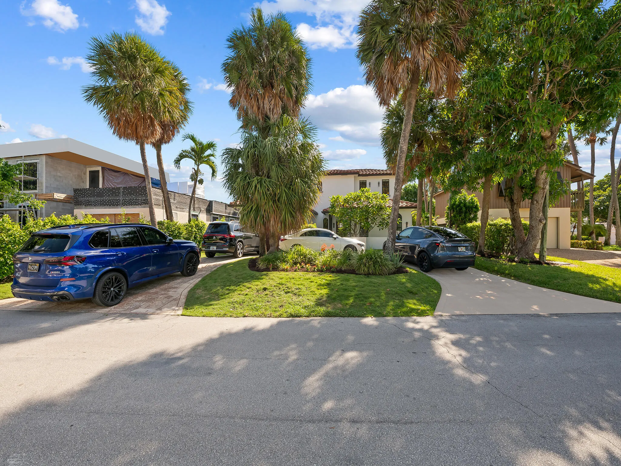 You can easily fit 4 automobiles in the driveway.