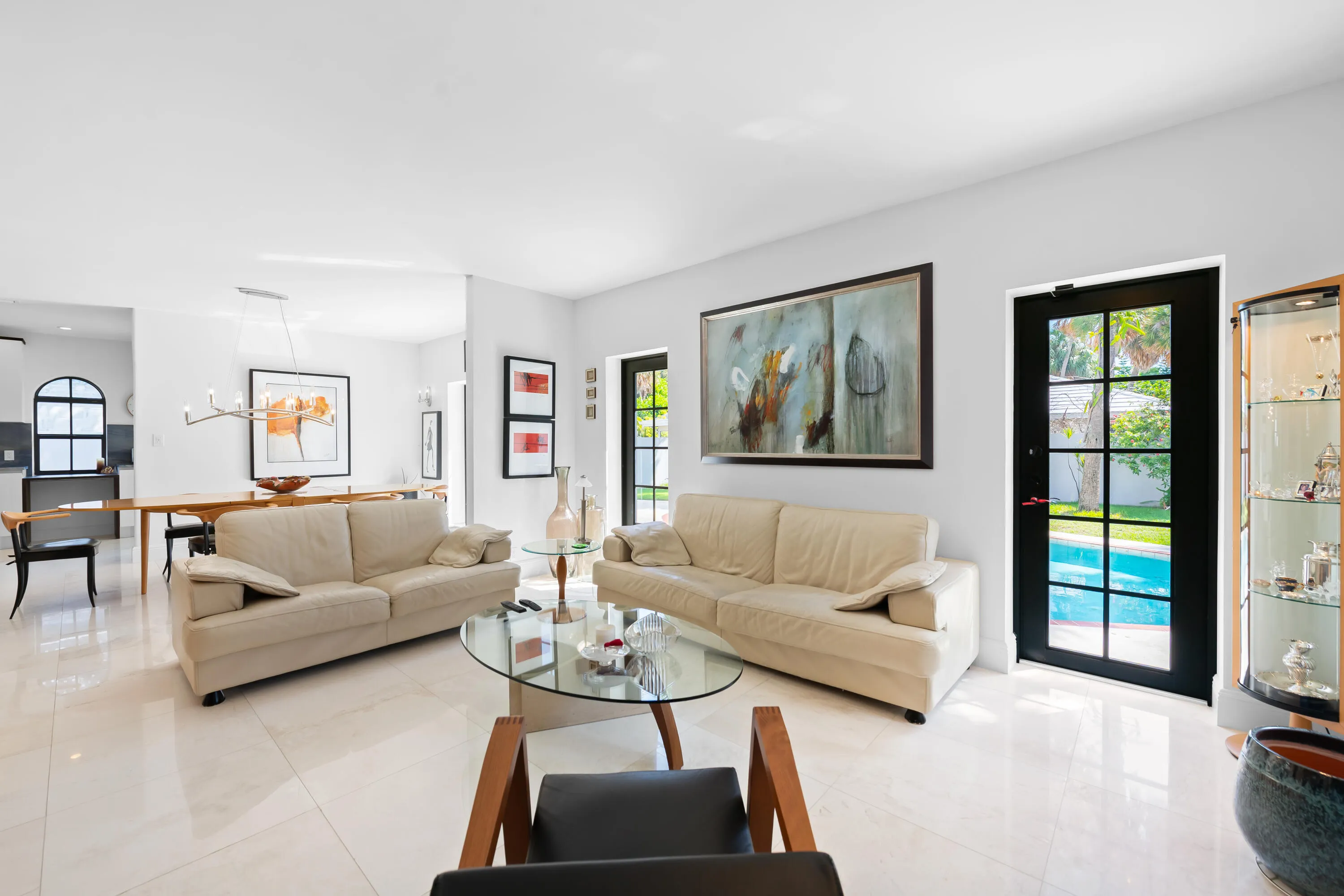 Living room. This is light and bright. The windows in the home are impact for style and protection.