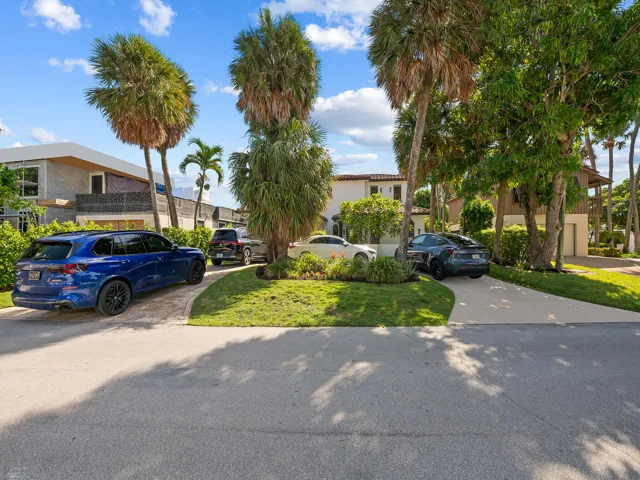 You can easily fit 4 automobiles in the driveway.