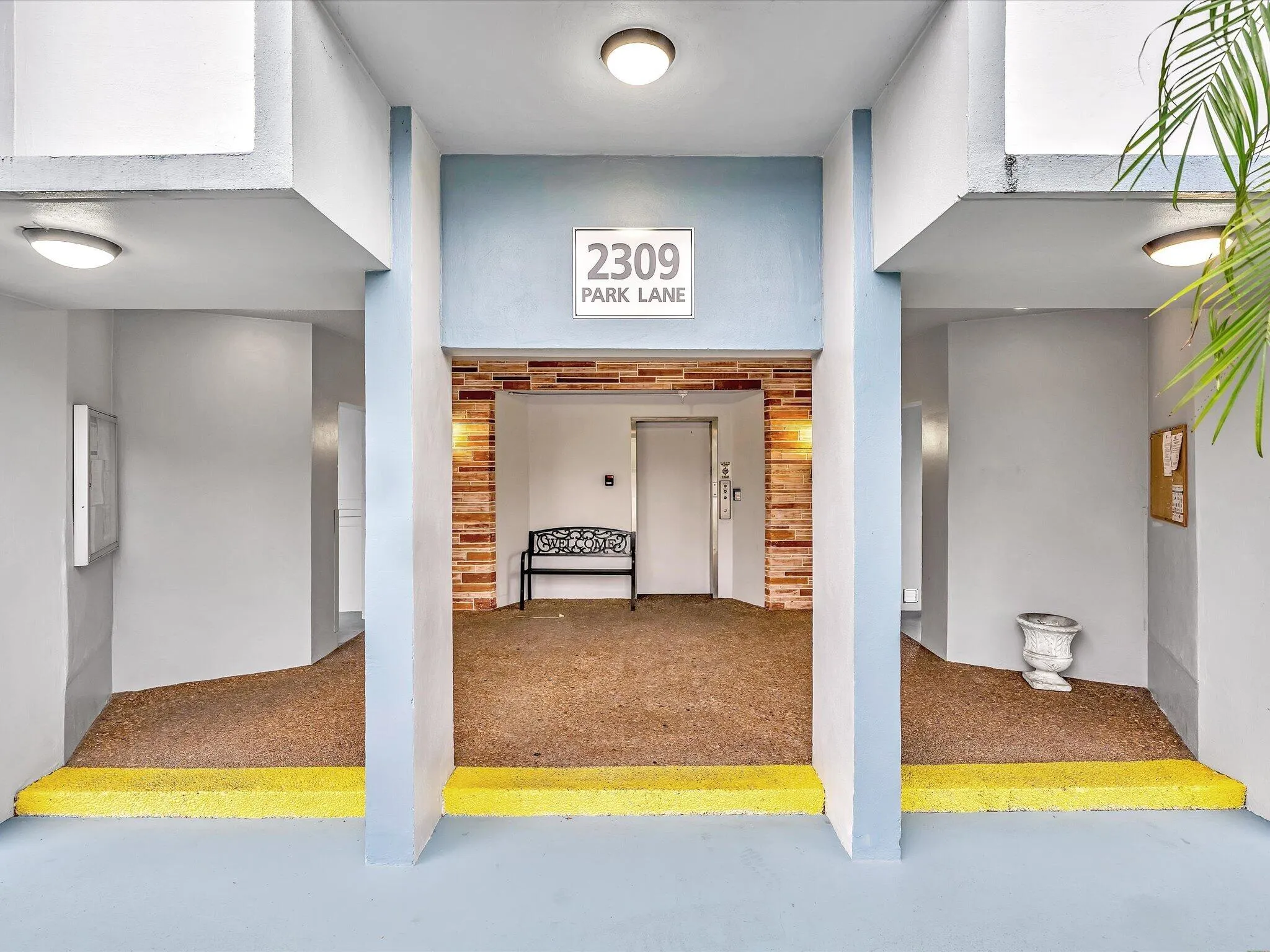2309 Park Lane features three distinct room entries with bright yellow threshold accents and cork flooring