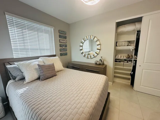 2nd guest bedroom with custom closet and lighting
