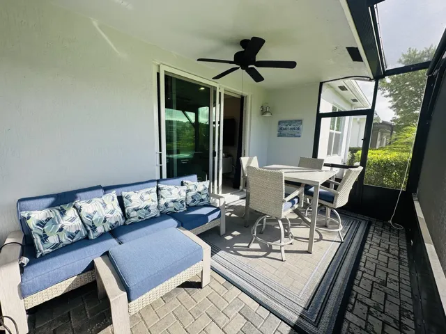 Screened Patio with screen door to the backyard waterfront area