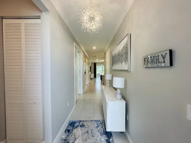 front door entry with 2 stacked bedrooms on the right plus guest bathroom and laundry room