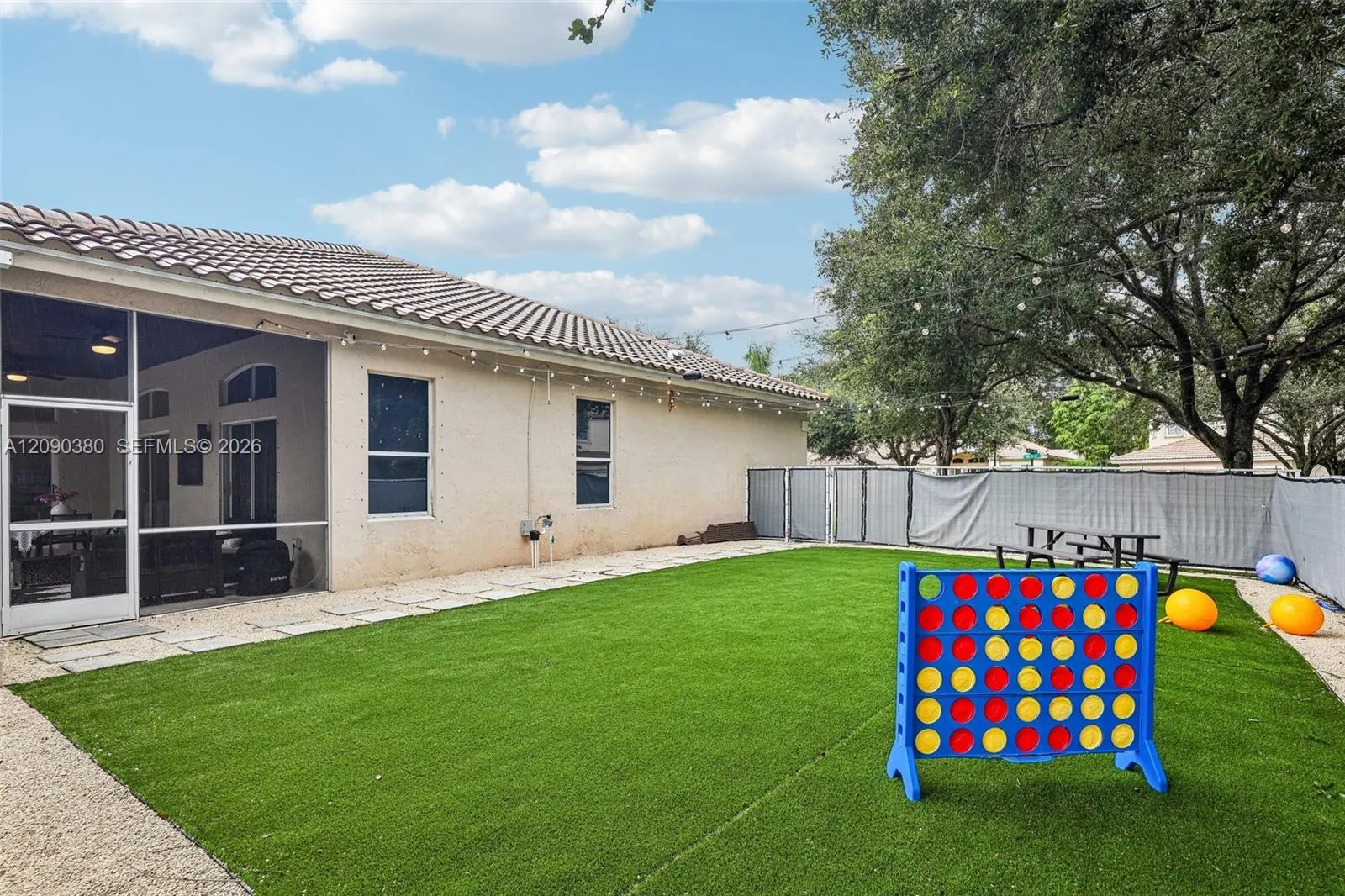Side corner yard with turf for minimum maintenance is a fantastic spot for games.