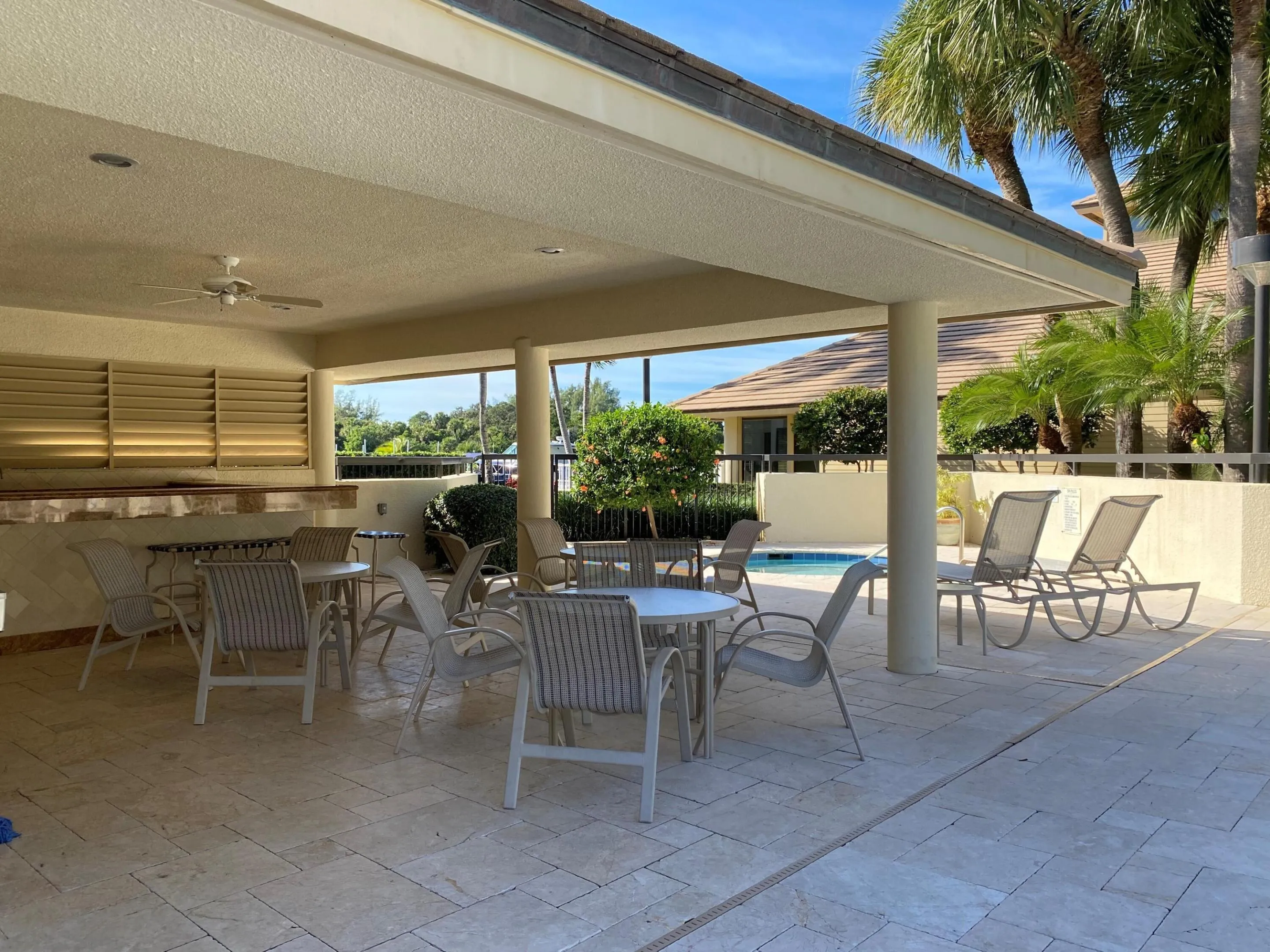 Covered seating area by pool oak