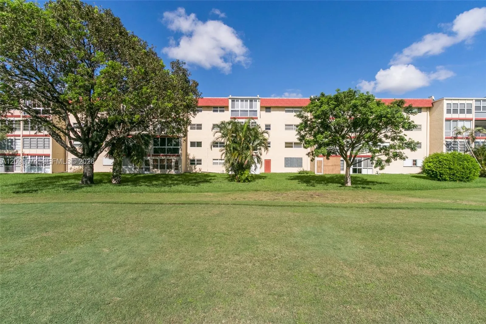 REAR OF BUILDING FROM GOLF COURSE