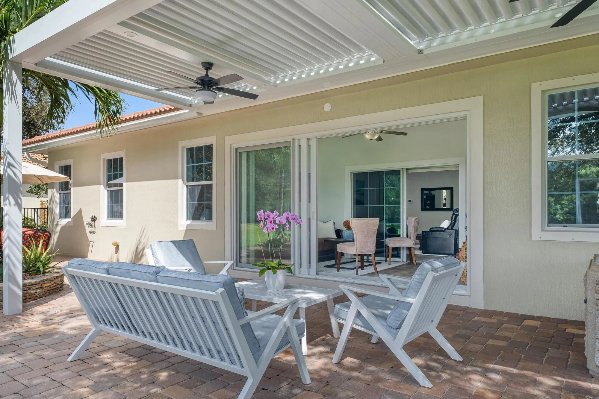 Transition from the Sunroom and the Pergola Seating Area