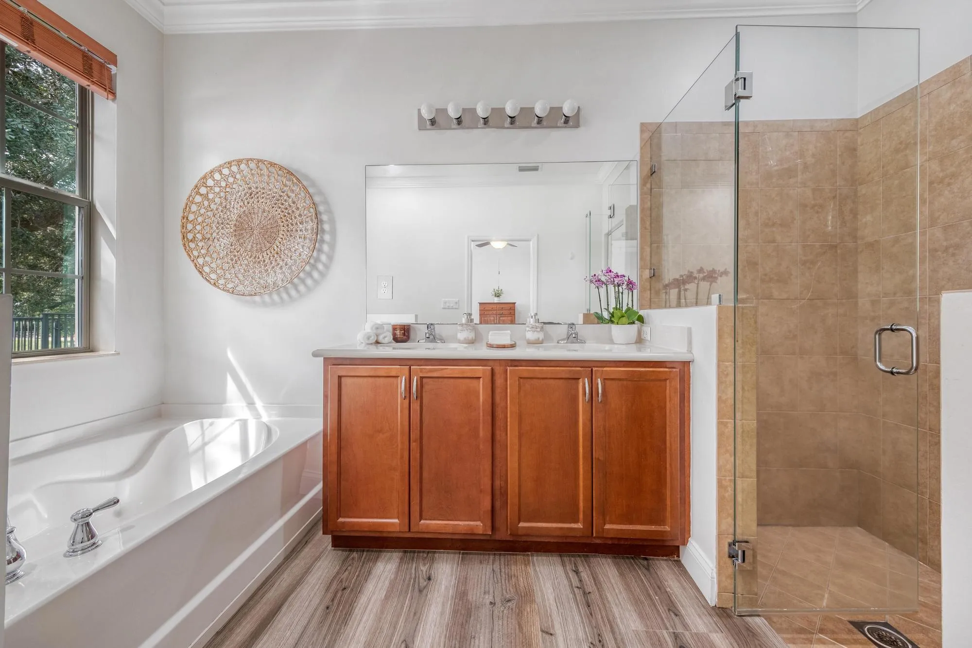 Primary Bathroom with Custom Made Shower Frameless Glass and Wood Cabinetry
