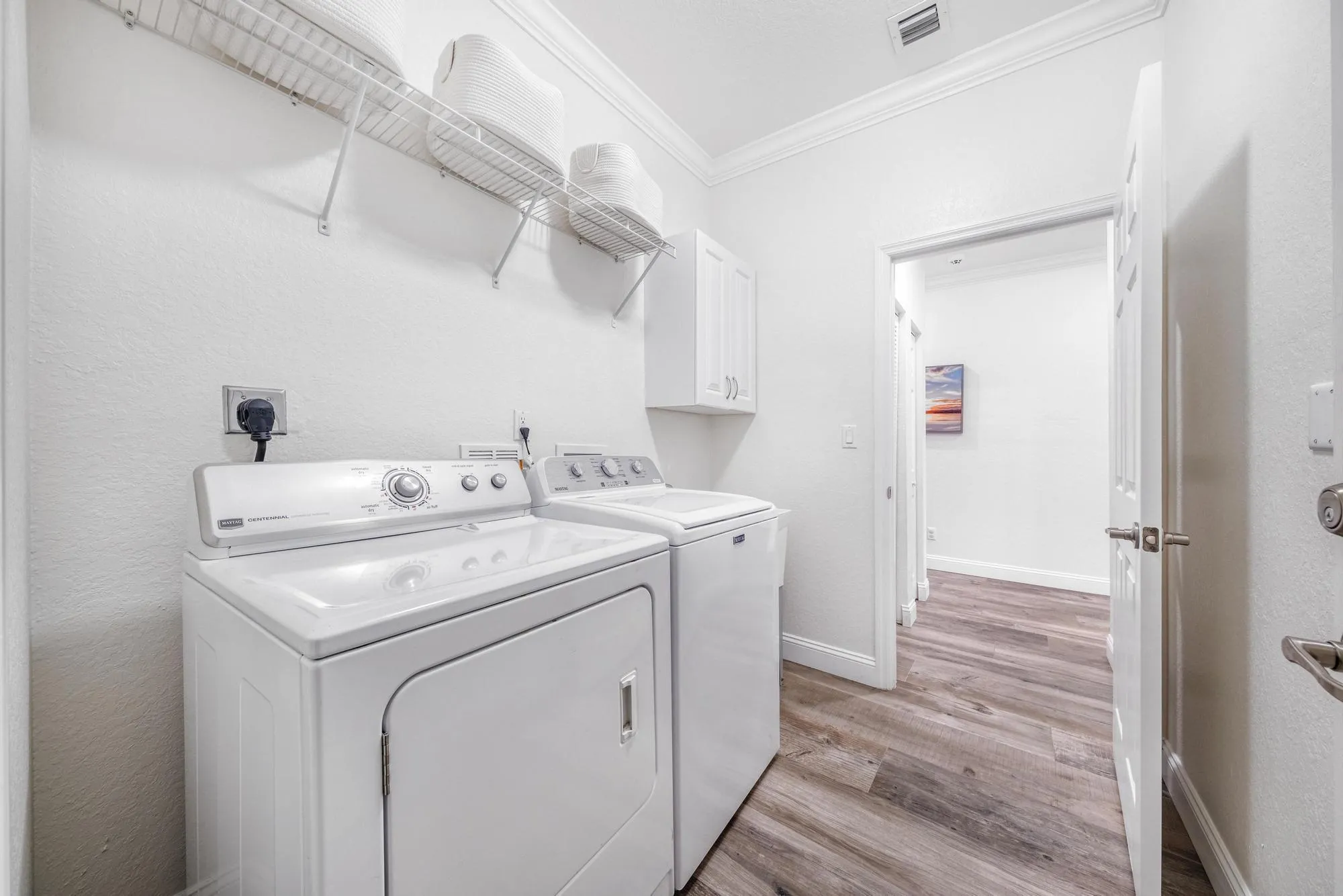 Laundry Room with Utility Sink Upper Cabinetry, and Direct Garage Access