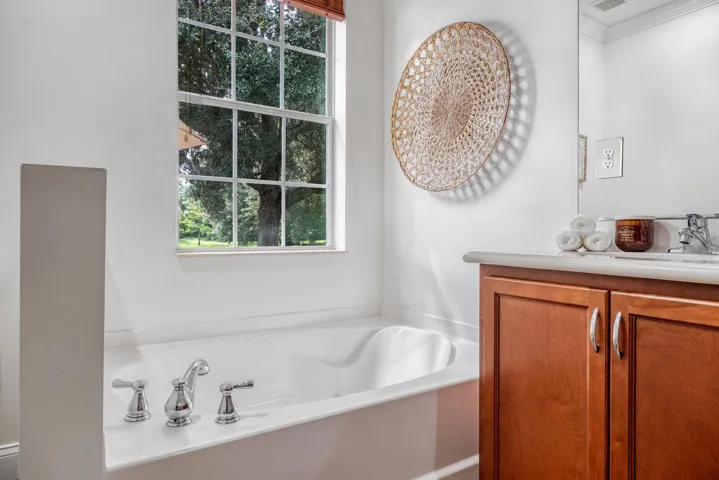 Bathtub Overlooking the Lake with Teak Window Shades Throughout