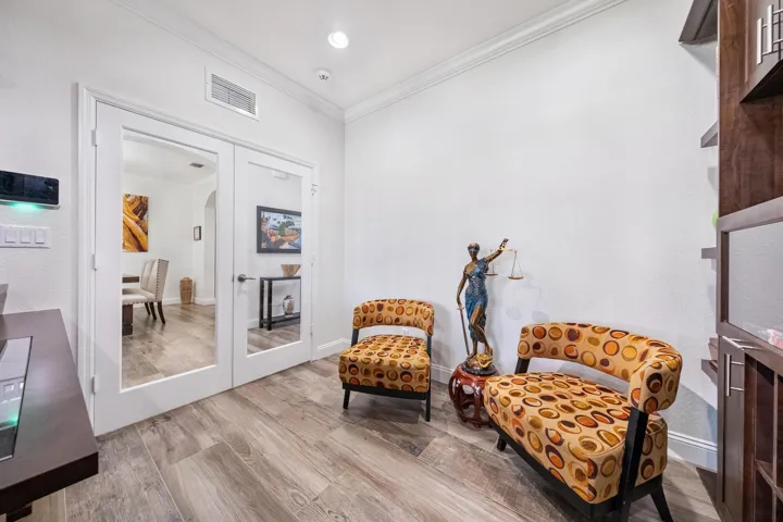 Private Office Space Set Behind Glass French Door off the Main Living Area