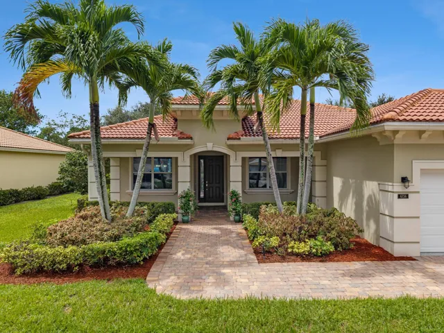 Front View Framed by Mature Royal Palms