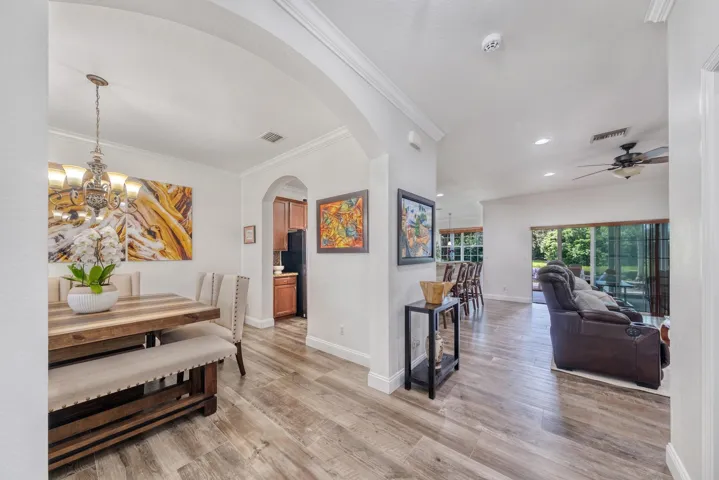 Foyer View with Spanish Porcelain Tiles and Crown Molding Throughout