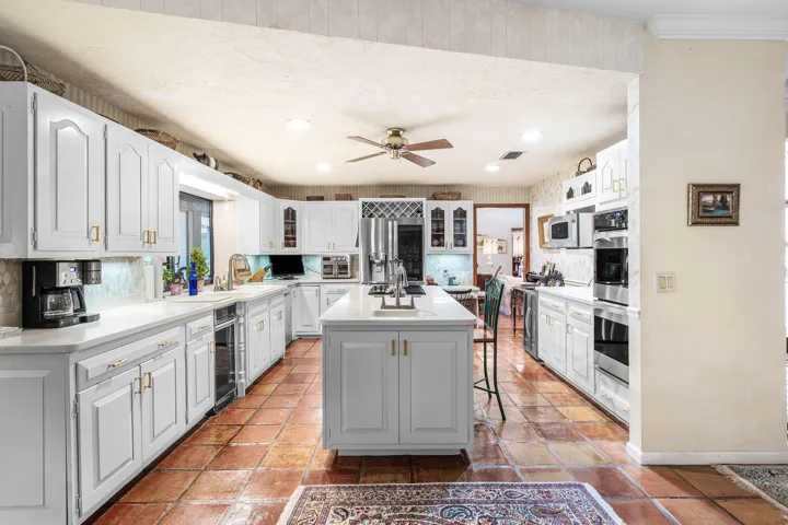 Kitchen featuring center island w/ prep sink & double oven