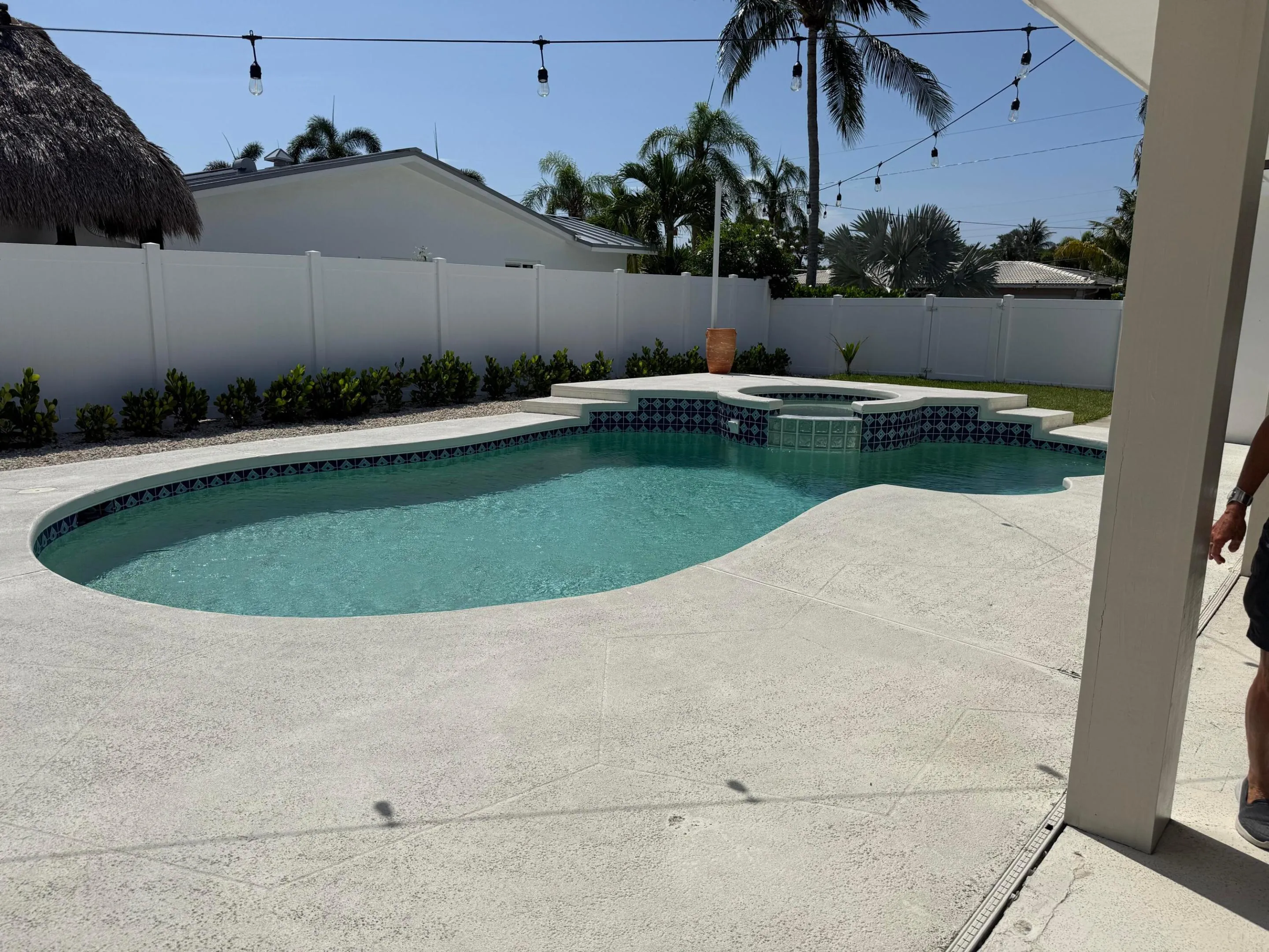 open pool with hot tub