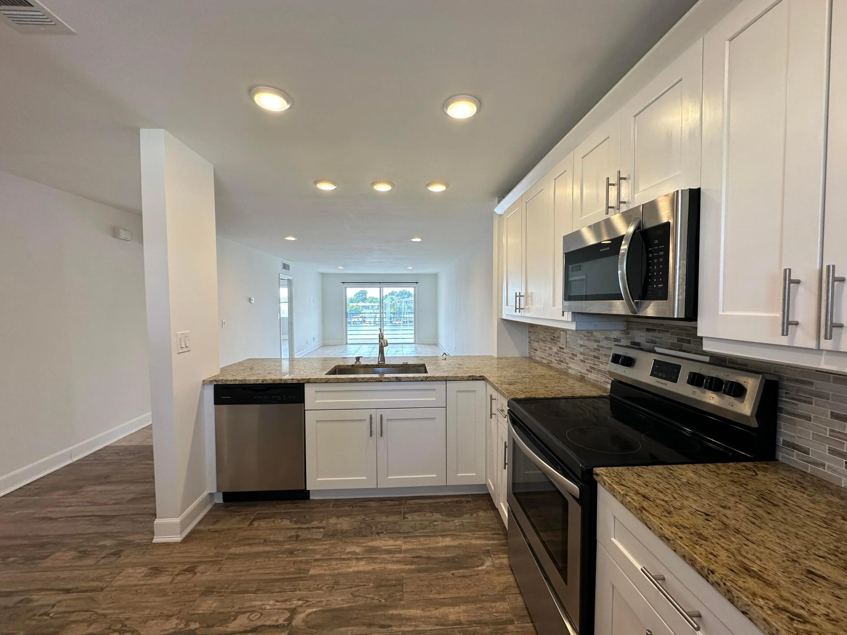 Granite countertops, stainless steel appliances, soft close cabinets